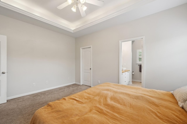 2142 Gold Valley Dr, Murfreesboro, TN 37130 - bedroom with light carpet, baseboards, a tray ceiling, a ceiling fan, and ensuite bath