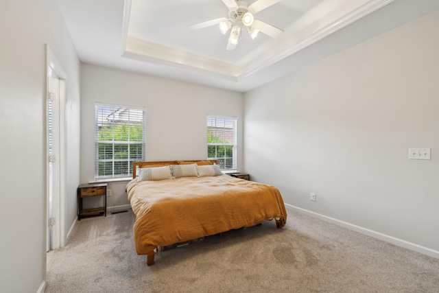 2142 Gold Valley Dr, Murfreesboro, TN 37130 - carpeted bedroom with a ceiling fan, a tray ceiling, ornamental molding, and baseboards