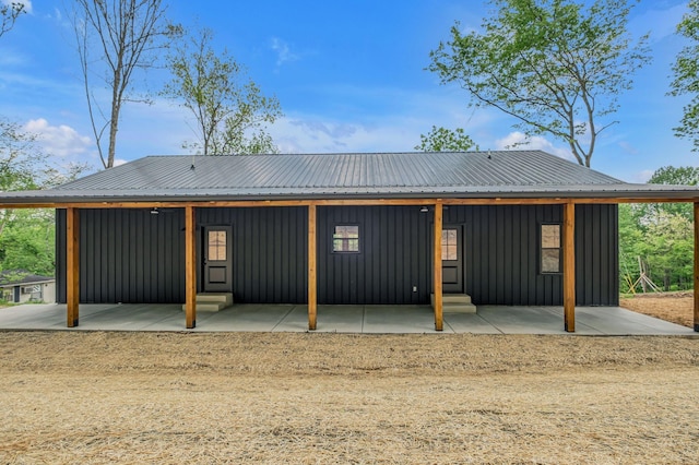 327 Turkey Creek Highway, Carthage, TN 37030 - back of property featuring board and batten siding, a patio, and metal roof