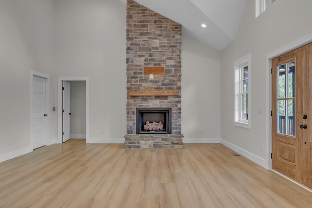 327 Turkey Creek Highway, Carthage, TN 37030 - unfurnished living room featuring baseboards, recessed lighting, a fireplace, wood finished floors, and high vaulted ceiling