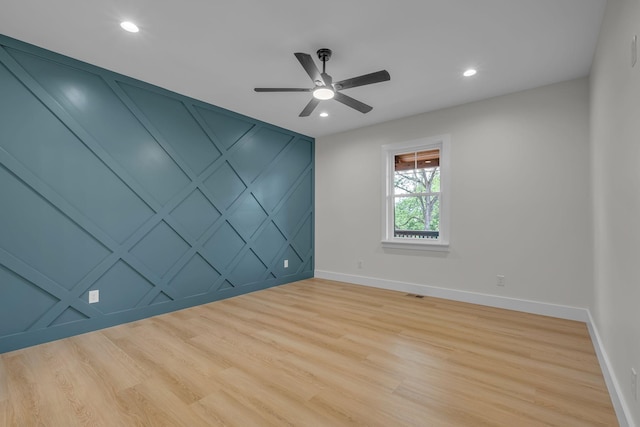 327 Turkey Creek Highway, Carthage, TN 37030 - spare room with baseboards, light wood finished floors, and a decorative wall