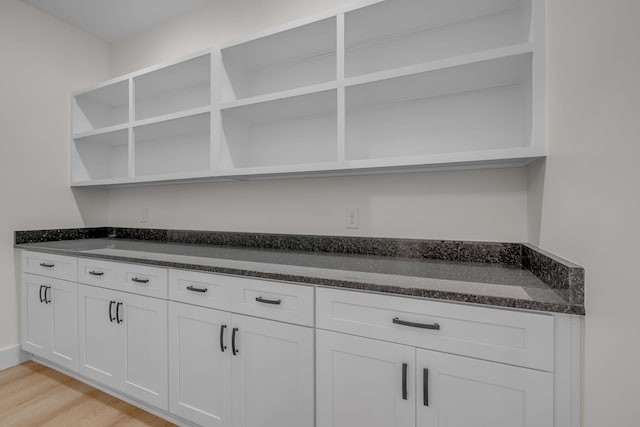 327 Turkey Creek Highway, Carthage, TN 37030 - kitchen featuring dark stone counters, light wood-type flooring, open shelves, and white cabinets