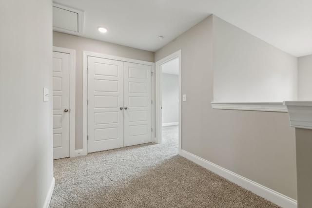 hall with recessed lighting, baseboards, and carpet