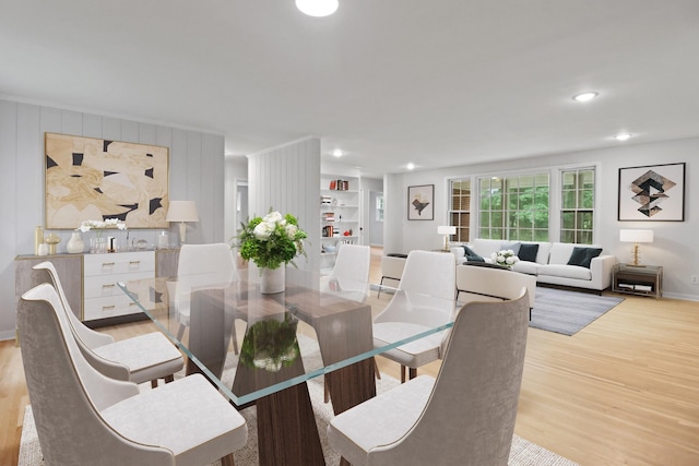 dining area featuring recessed lighting, light wood-style floors, and baseboards