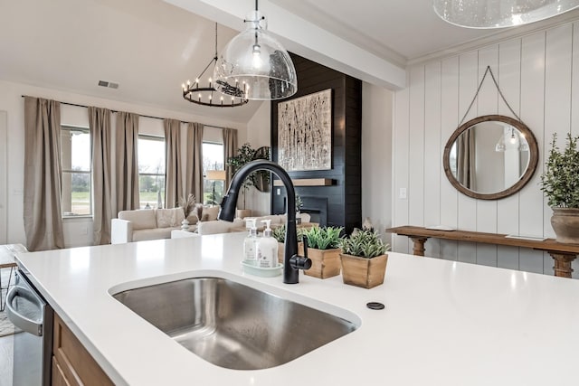 3222 Hopetown Way, Murfreesboro, TN 37129 - kitchen view of a sink, light countertops, pendant lighting, a fireplace, and ornamental molding