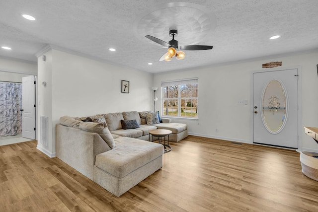369 Talpha Dr, Dowelltown, TN 37059 - living area with recessed lighting, visible vents, a ceiling fan, light wood-style floors, and a textured ceiling