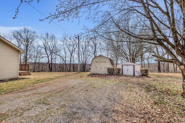 369 Talpha Dr, Dowelltown, TN 37059 - view of yard featuring an outbuilding and a shed