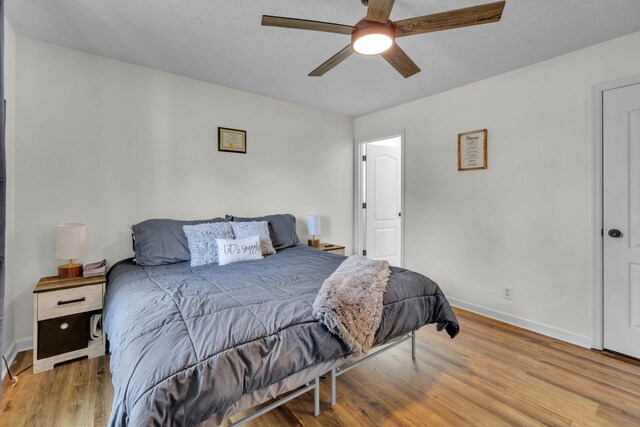 369 Talpha Dr, Dowelltown, TN 37059 - bedroom featuring baseboards, a ceiling fan, and wood finished floors