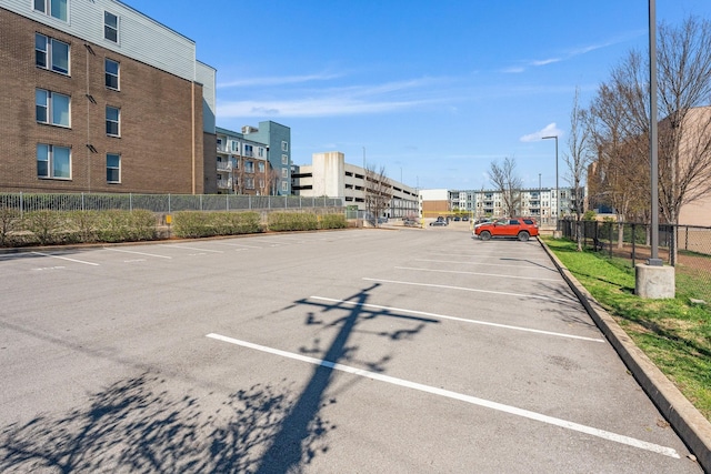 uncovered parking lot with fence