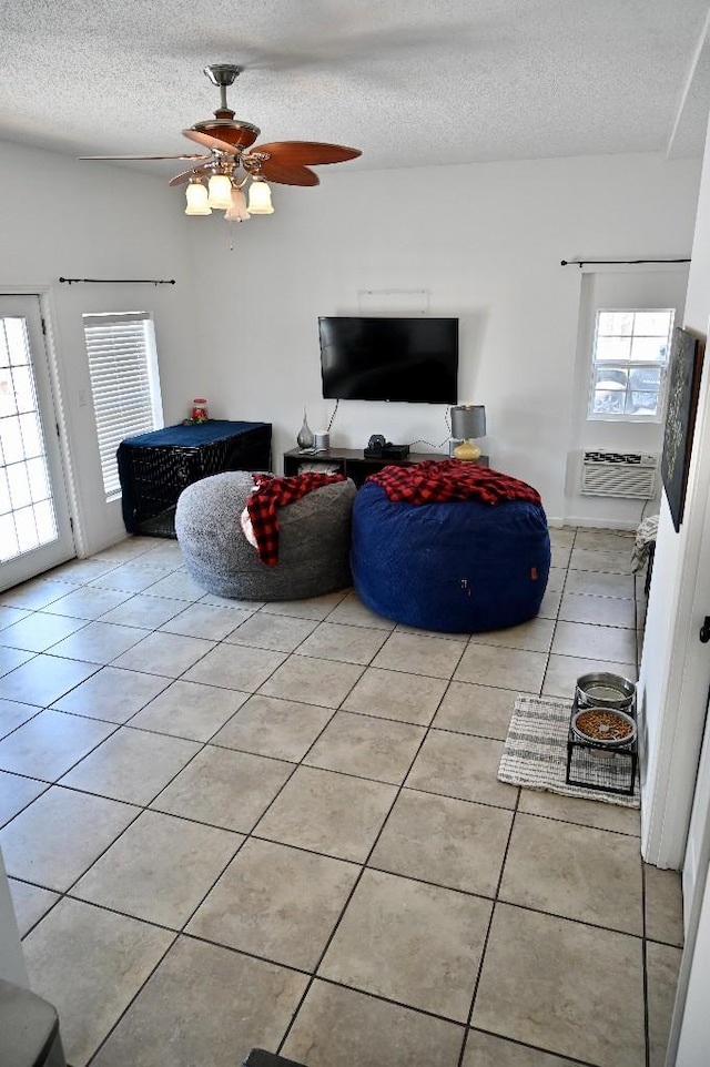 4310 Memory Ln, Adams, TN 37010 - living area with a wall unit AC, light tile patterned floors, a textured ceiling, and a ceiling fan