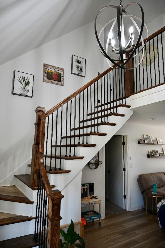 4310 Memory Ln, Adams, TN 37010 - staircase with wood finished floors, a chandelier, and vaulted ceiling