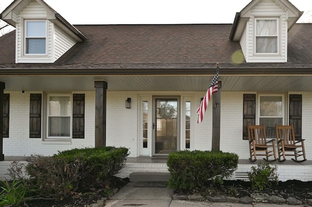 4310 Memory Ln, Adams, TN 37010 - property entrance featuring covered porch, brick siding, and a shingled roof