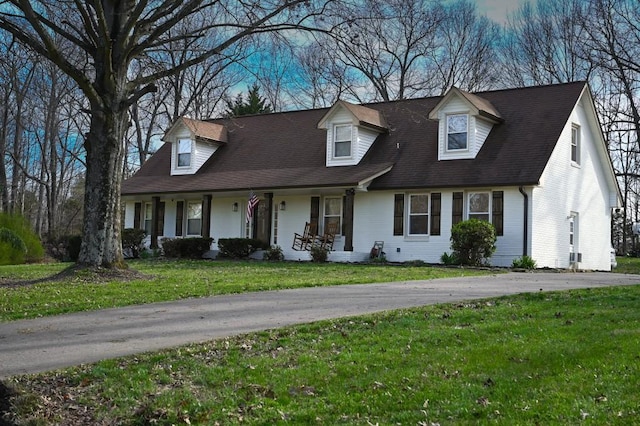 4310 Memory Ln, Adams, TN 37010 - cape cod home featuring covered porch and a front yard
