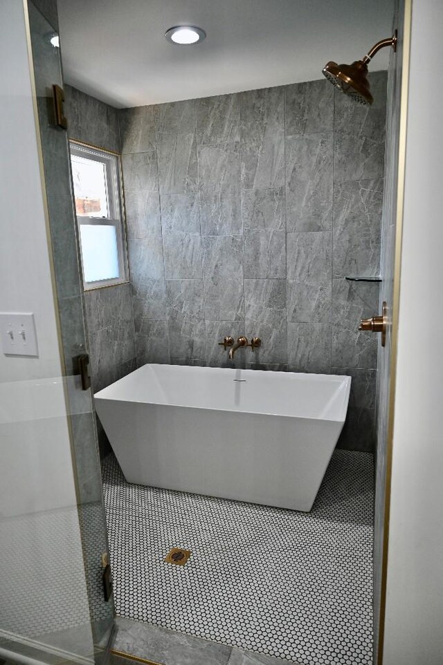 4310 Memory Ln, Adams, TN 37010 - bathroom with tile walls, a freestanding tub, and a tile shower
