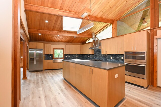 1061 Ridgecrest Dr, Goodlettsville, TN 37072 - kitchen with appliances with stainless steel finishes, a skylight, wood ceiling, light brown cabinets, and a kitchen island
