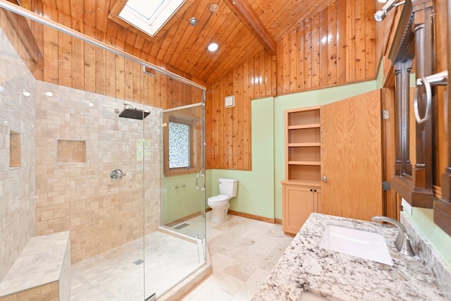 1061 Ridgecrest Dr, Goodlettsville, TN 37072 - bathroom with lofted ceiling, wooden ceiling, a shower stall, a skylight, and toilet