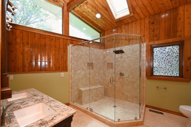 1061 Ridgecrest Dr, Goodlettsville, TN 37072 - full bathroom with lofted ceiling, tile patterned flooring, a stall shower, a skylight, and toilet