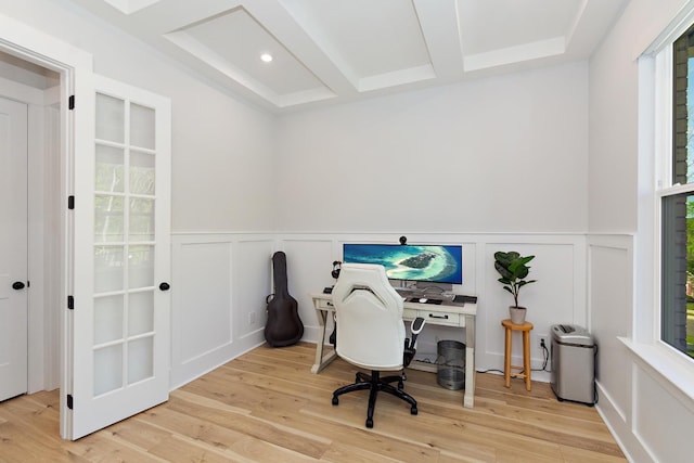 office space with beamed ceiling, plenty of natural light, a wainscoted wall, and a decorative wall