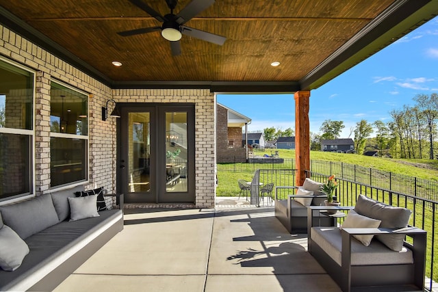 view of patio with ceiling fan, fence, and an outdoor hangout area