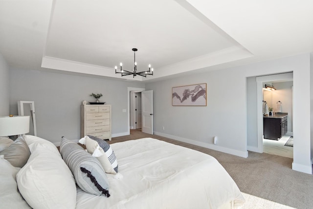 bedroom featuring light colored carpet, baseboards, a notable chandelier, and a tray ceiling