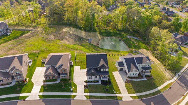 bird's eye view with a water view and a residential view
