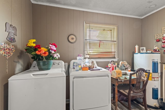 washroom with washing machine and clothes dryer, laundry area, ornamental molding, a textured ceiling, and electric water heater