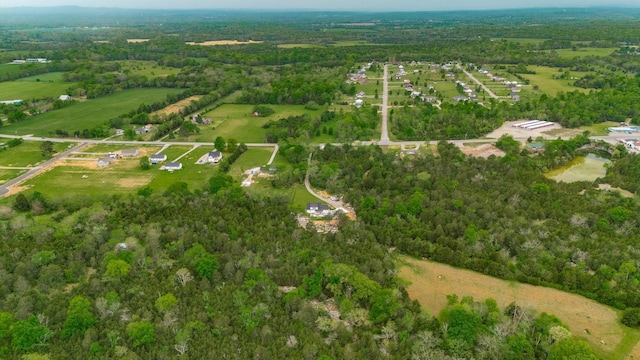 aerial view with a forest view and a rural view