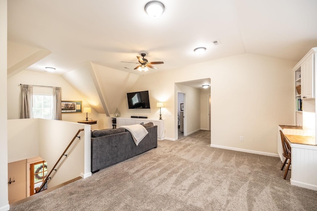 living area with ceiling fan, baseboards, light colored carpet, lofted ceiling, and visible vents