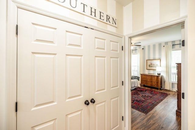 hall with wood finished floors
