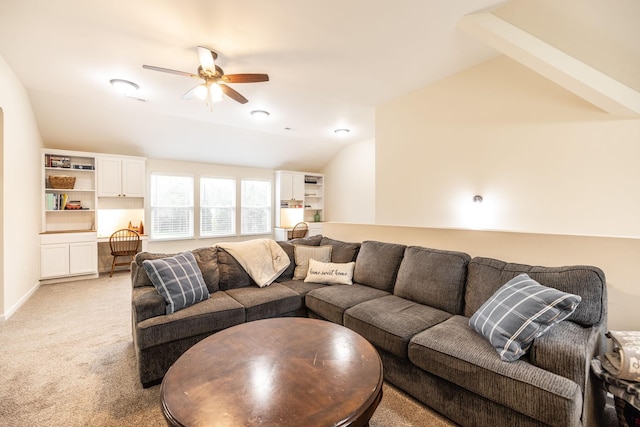 living room featuring vaulted ceiling, ceiling fan, and light carpet