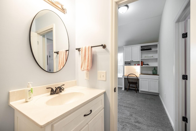 bathroom featuring baseboards and vanity