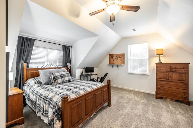 bedroom featuring a ceiling fan, light carpet, baseboards, lofted ceiling, and visible vents