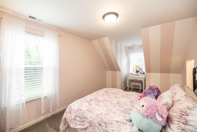 carpeted bedroom featuring visible vents