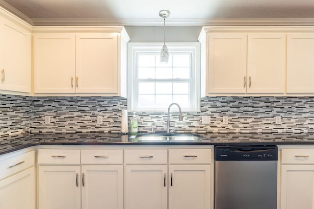 kitchen with dishwasher, dark countertops, and a sink