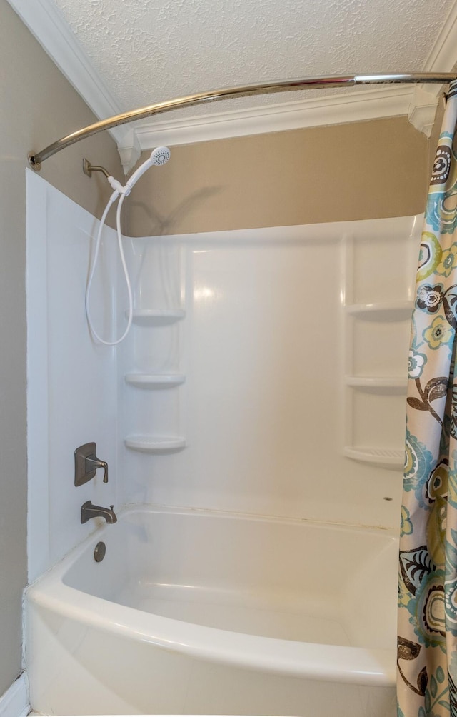 bathroom featuring a textured ceiling and shower / bath combo with shower curtain
