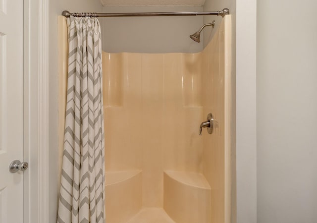 bathroom with curtained shower