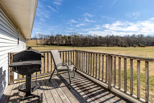 deck with a lawn and a grill