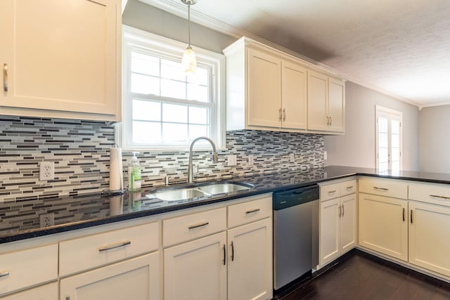 kitchen featuring backsplash, stainless steel dishwasher, dark wood-style flooring, and a sink