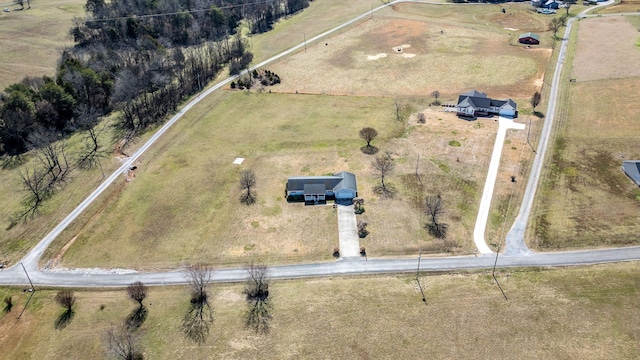 birds eye view of property with a rural view