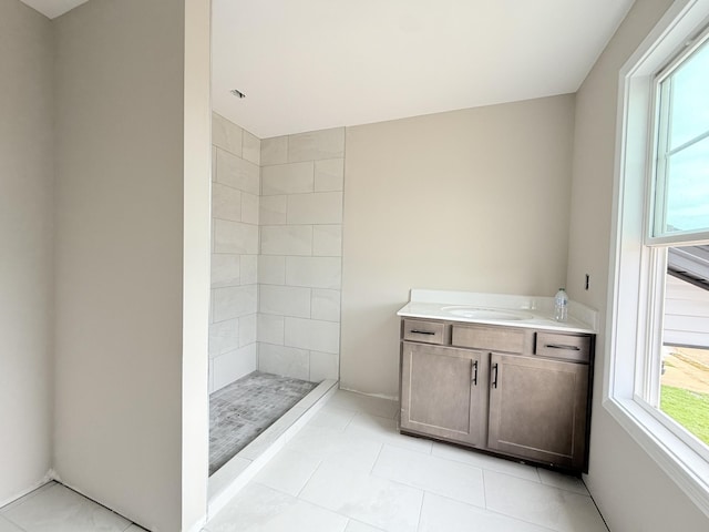 175 Cardinal Crk, Clarksville, TN 37040 - bathroom with vanity, tiled shower, and tile patterned flooring