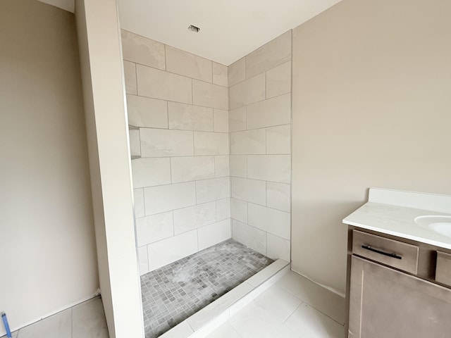 175 Cardinal Crk, Clarksville, TN 37040 - bathroom featuring tiled shower, vanity, and tile patterned floors