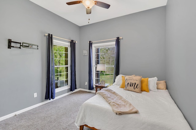 bedroom with baseboards, carpet flooring, and ceiling fan