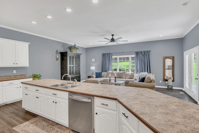 kitchen with stainless steel dishwasher, a ceiling fan, plenty of natural light, and a sink