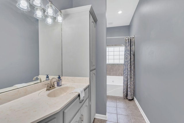 full bathroom with baseboards, shower / bath combination with curtain, tile patterned flooring, and vanity