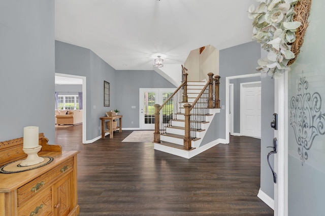 entryway featuring stairs, baseboards, and dark wood-style floors