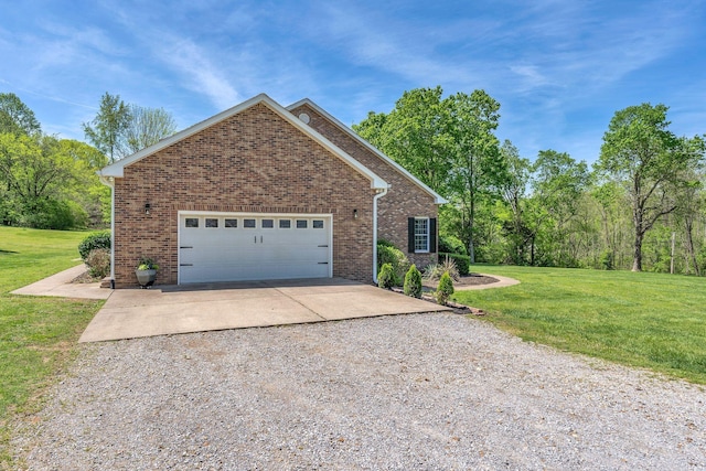 view of front facade featuring brick siding, a garage, a front lawn, and driveway