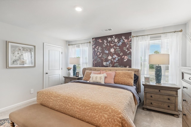 carpeted bedroom with baseboards, wallpapered walls, and visible vents