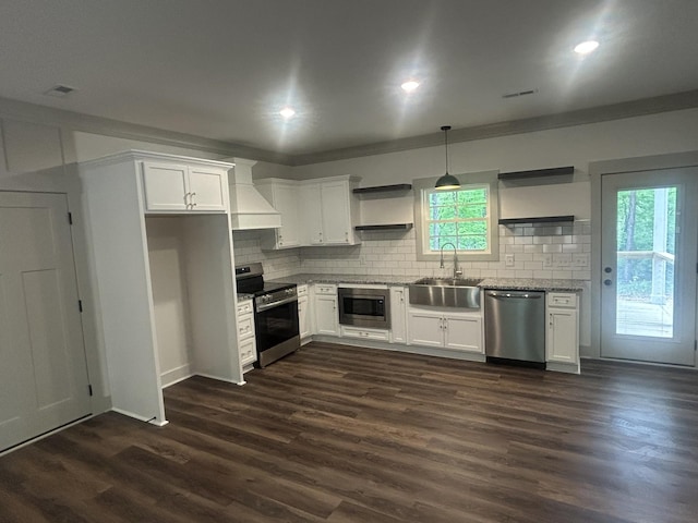 kitchen with open shelves, premium range hood, white cabinets, a sink, and stainless steel appliances