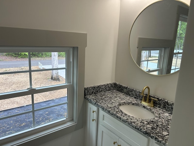 bathroom with vanity and a wealth of natural light