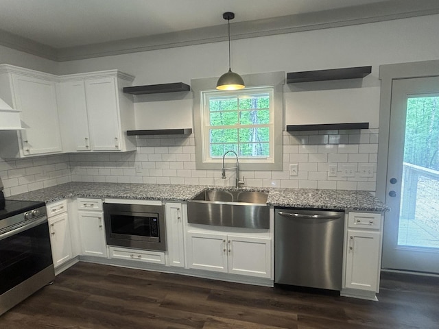 kitchen with open shelves, light stone countertops, a sink, stainless steel appliances, and white cabinetry